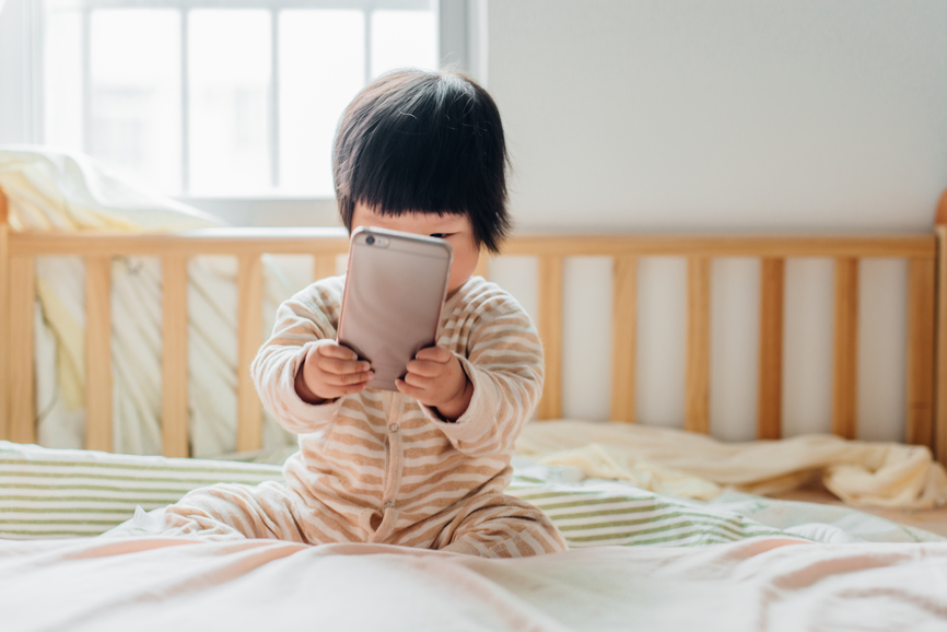 baby girl using cell phone