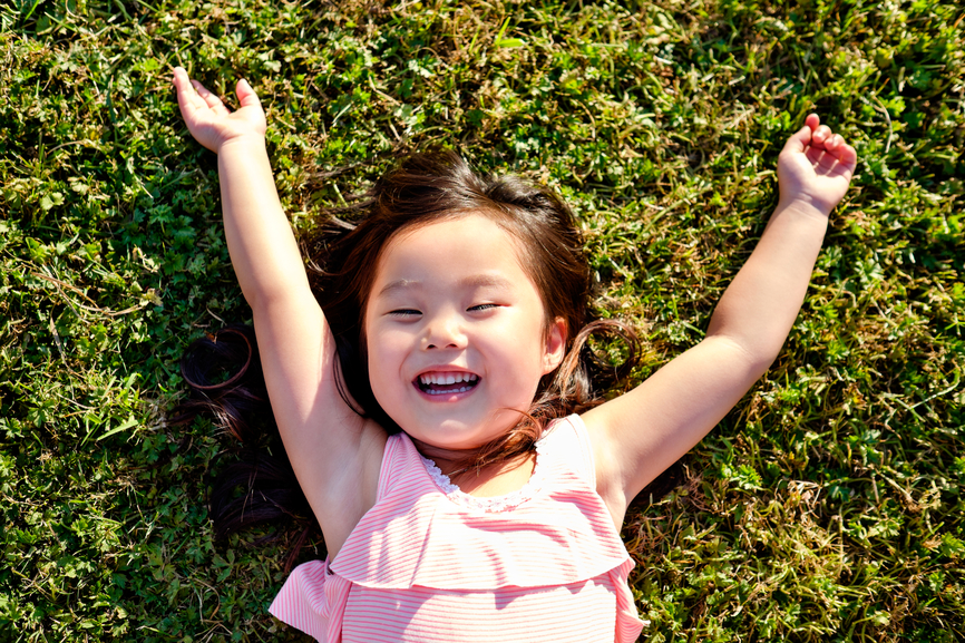 Happy Asian Girl Outdoor In A Park