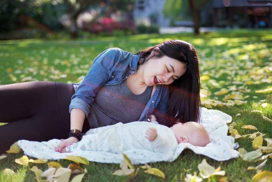 Happy Mother And Baby In A Park