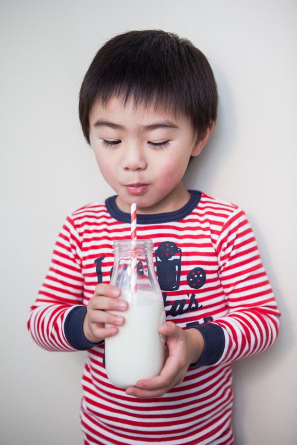 Cute Asian Boy Drinking Milk